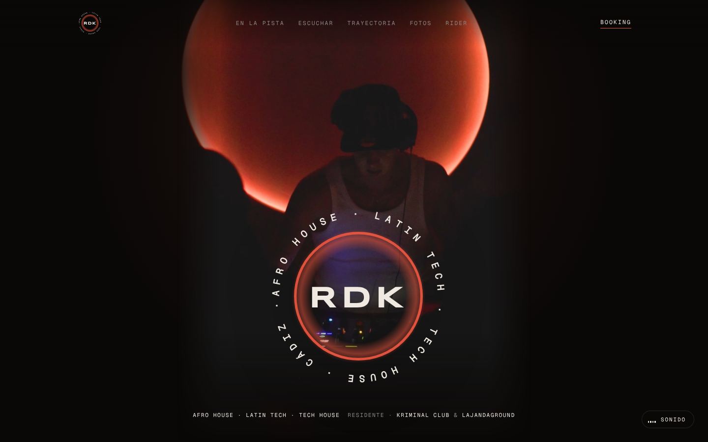 Home screen of the RDK website: the DJ on stage in front of a red circular light, with a round logo and the genres Afro House, Latin Tech and Tech House.