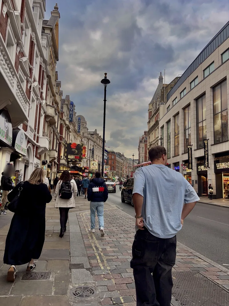 Valentín walking down Shaftesbury Avenue, London.